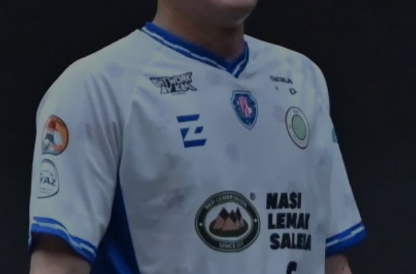 Close-up of the PJJ away shirt: white with blue trim, crest and Nasi Lemak Saleha logo