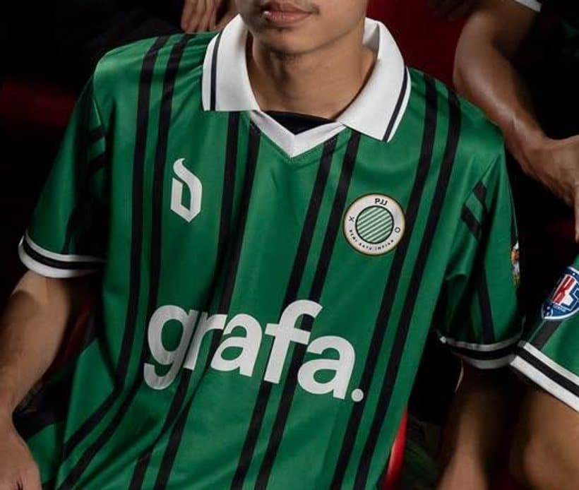 Close-up of the green pinstriped PJJ home shirt